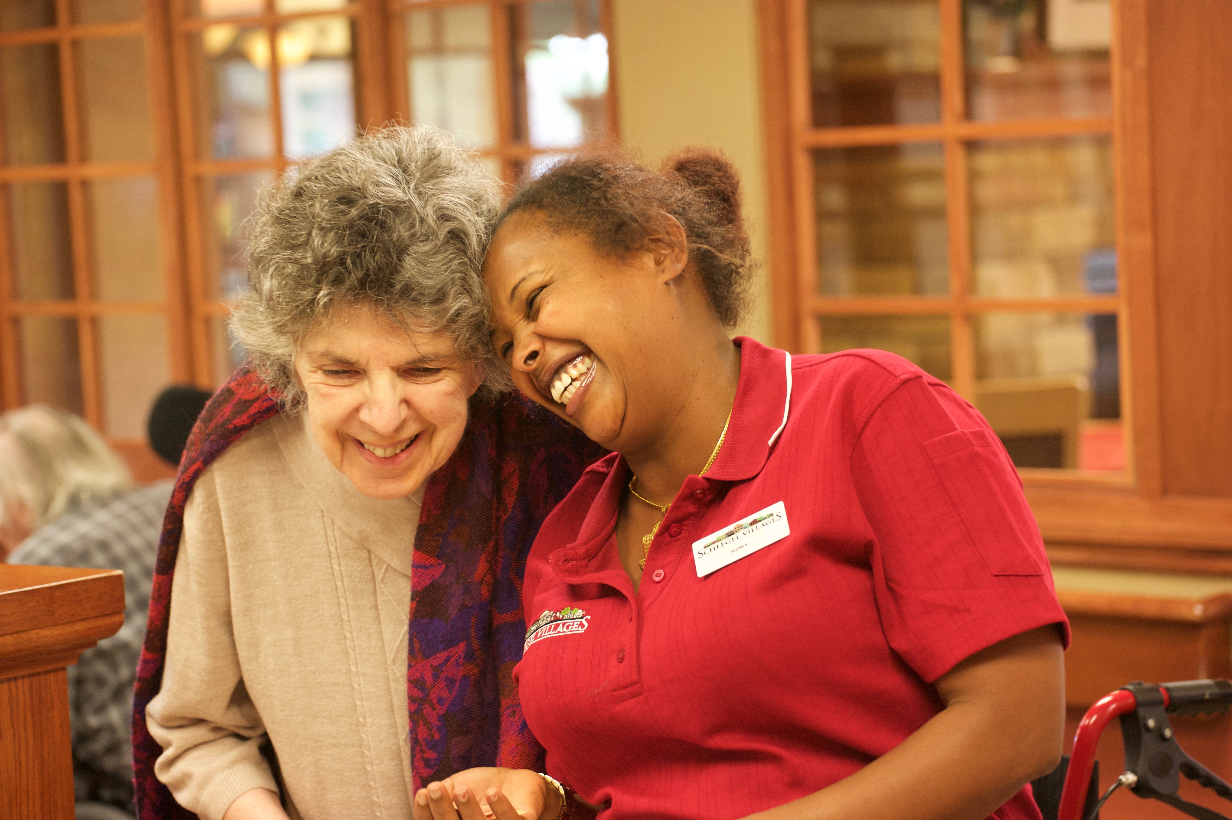 Schlegel Villages team member laughing with senior