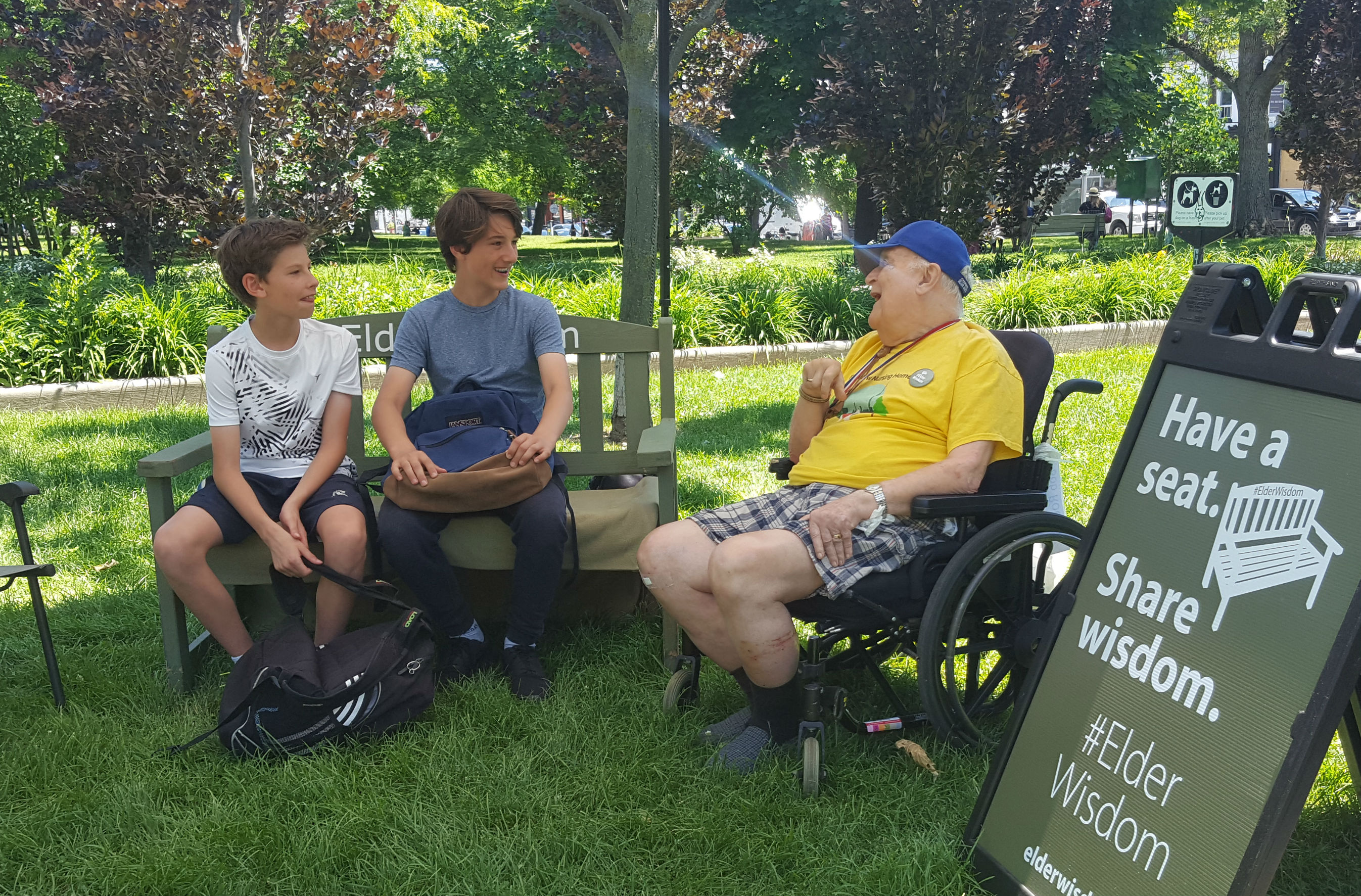 Two youth join Bob at the #ElderWisdom bench in Toronto's Trinity Bellwoods Park