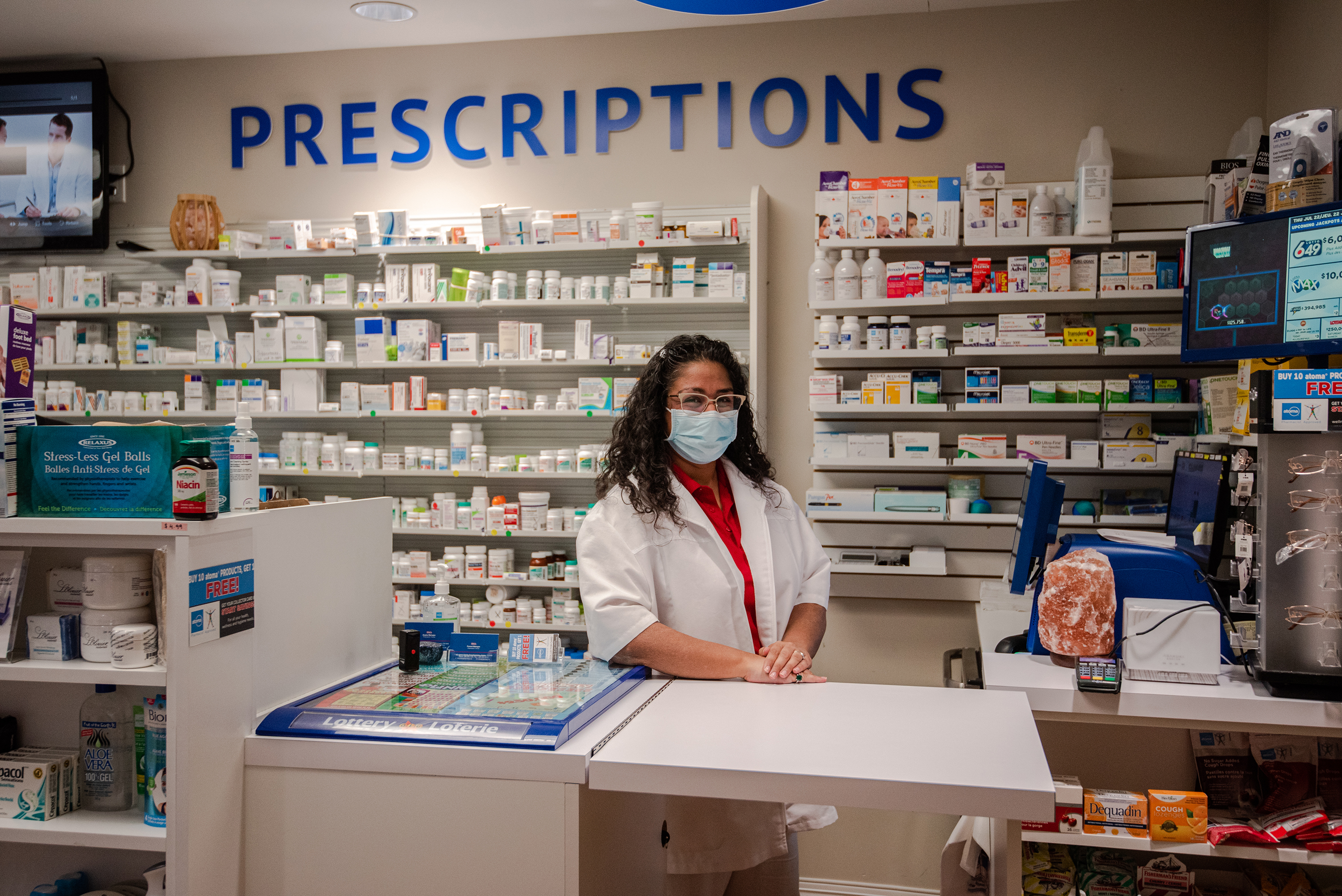 Pharmacist poses at the integrated Village pharmacy.