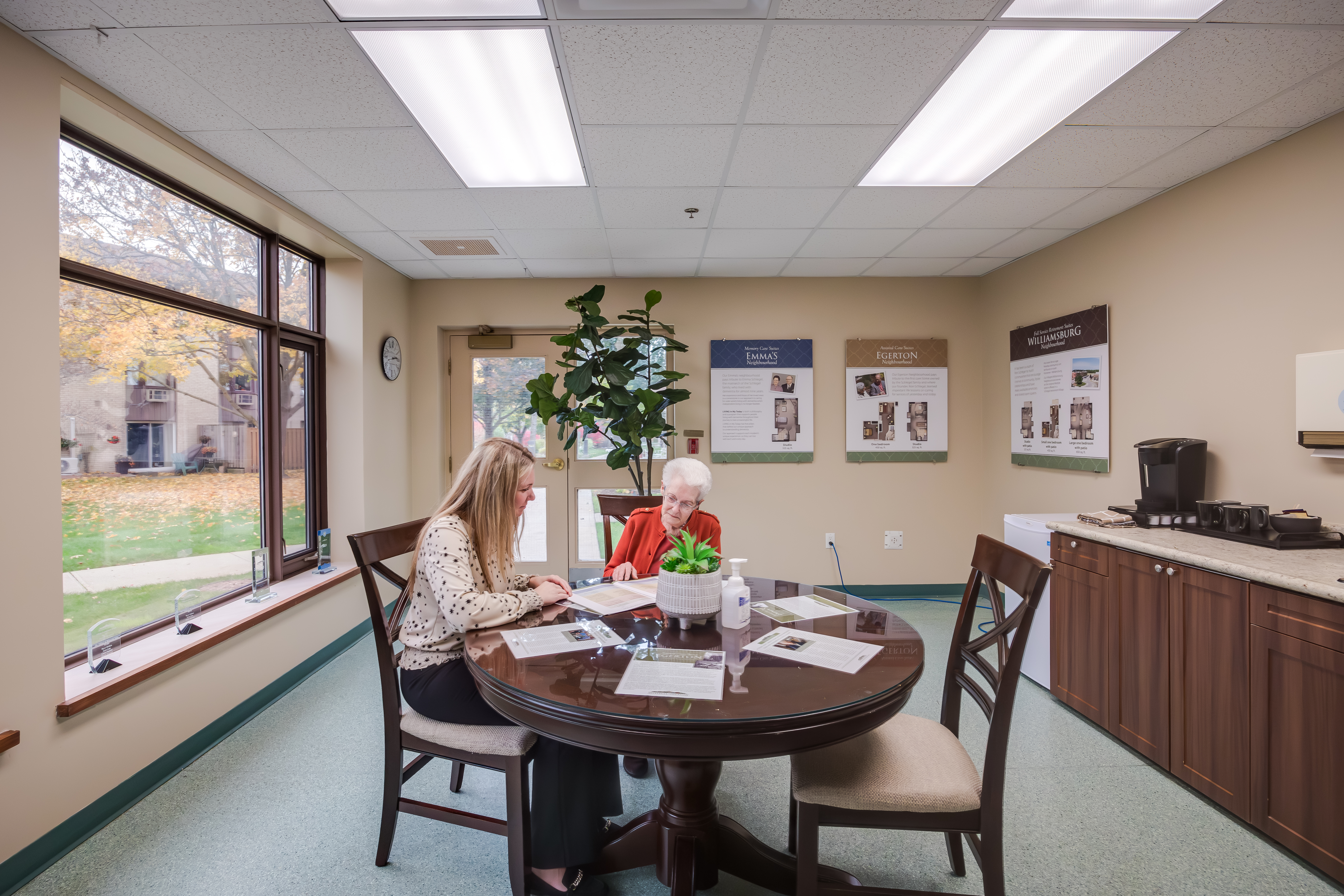 Director of Lifestyle Options meets with future resident in the Welcome Centre at The Village of Riverside Glen