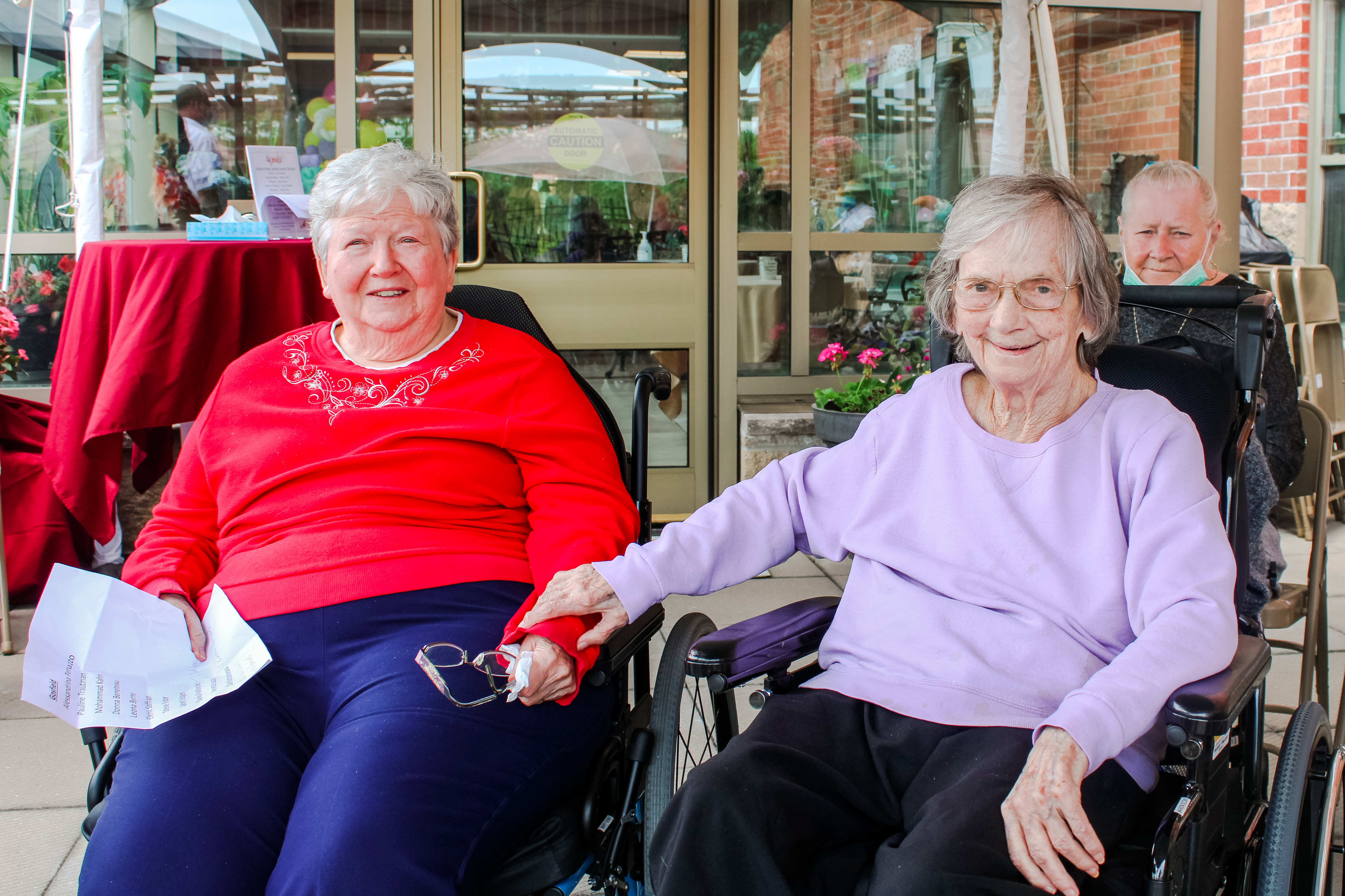 Residents enjoying the Healing Garden opening event