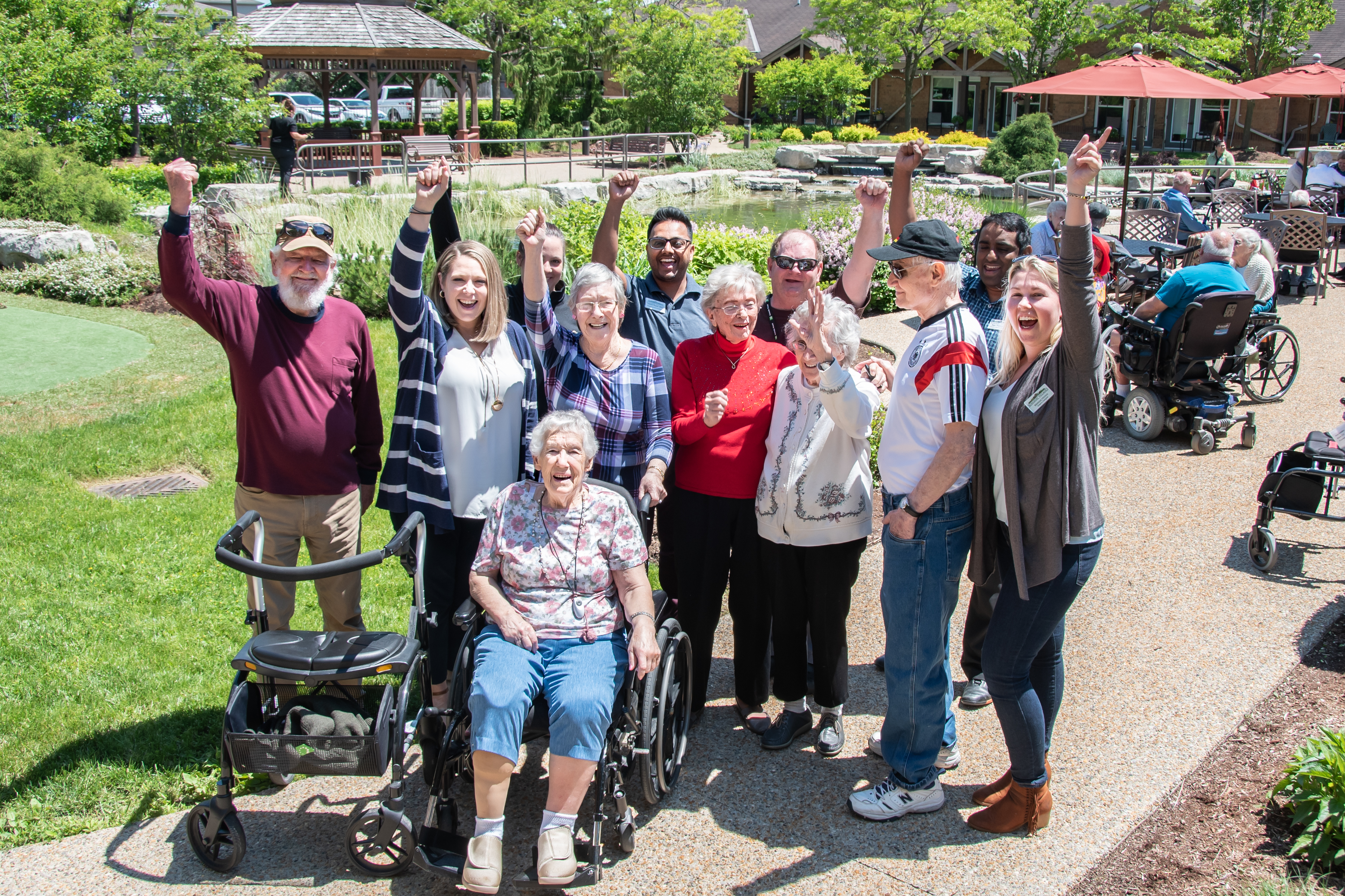 Group of residents and team members enjoying a gathering in the Courtyard