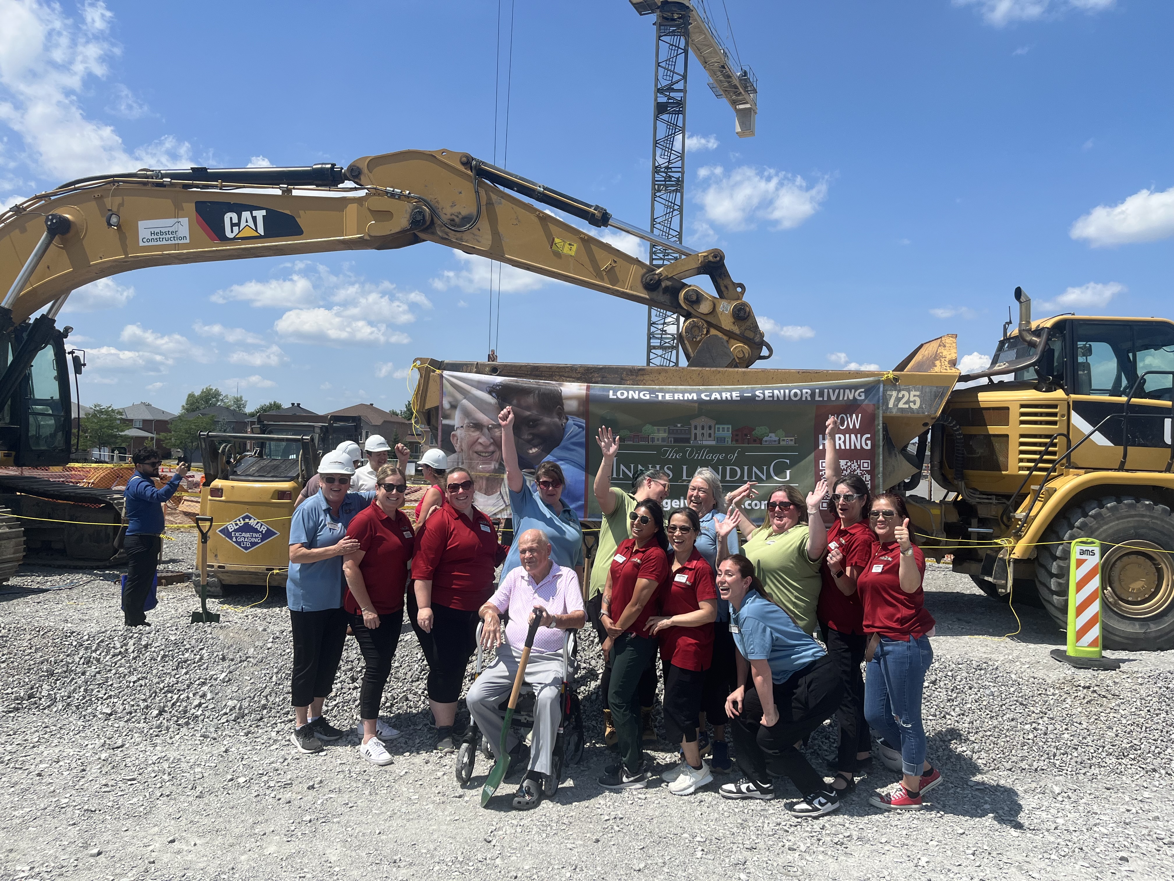 The Coleman Team excitedly poses with Ron Schlegel during the groundbreaking ceremony in Barrie July 28.