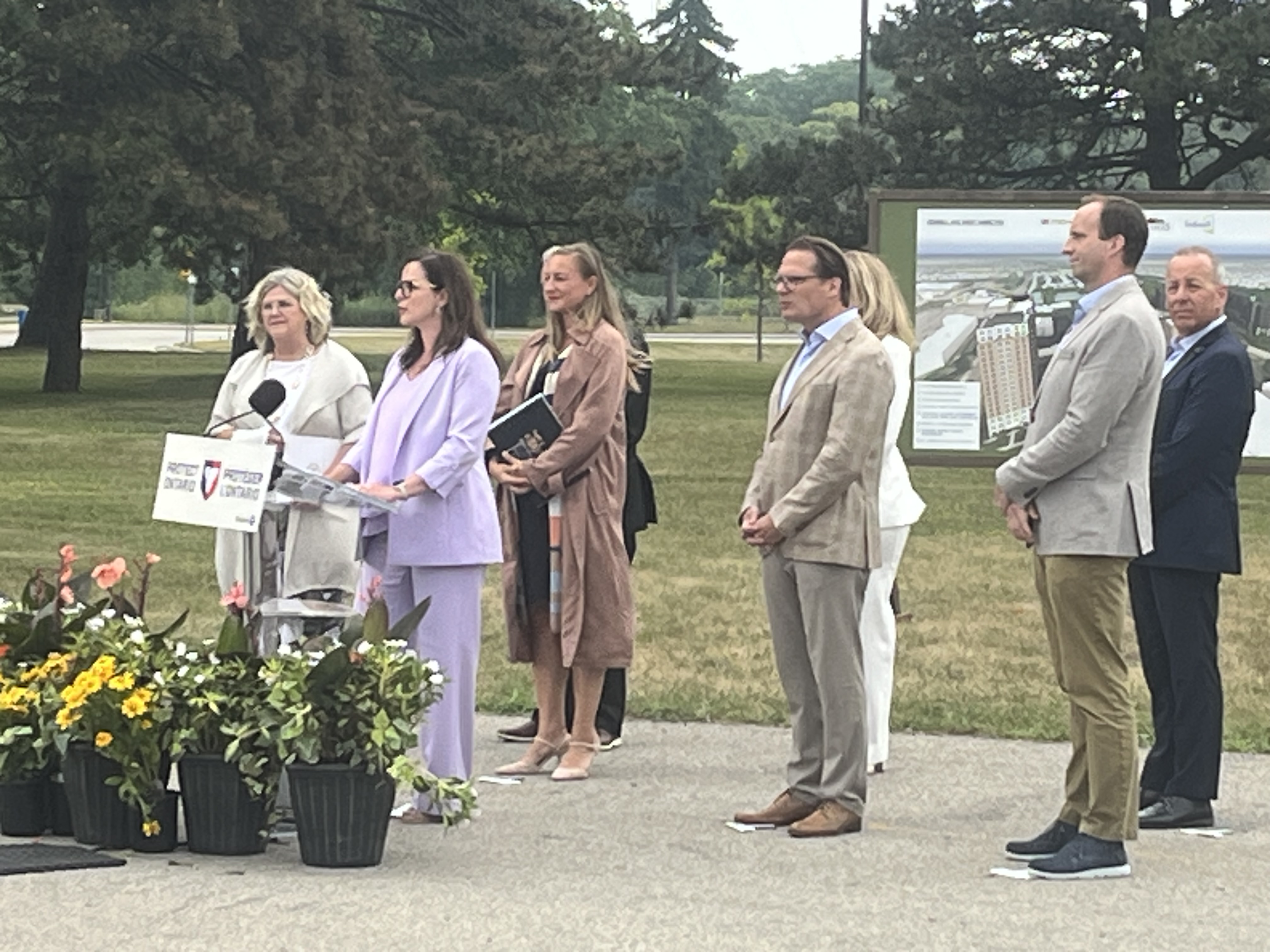 Minister Kusendova-Bashta offers remarks alongside Schlegel Villages president and CEO Jamie Schlegel and several other dignitaries during the announcement of the Village of Fennell Ridge in Hamilton.